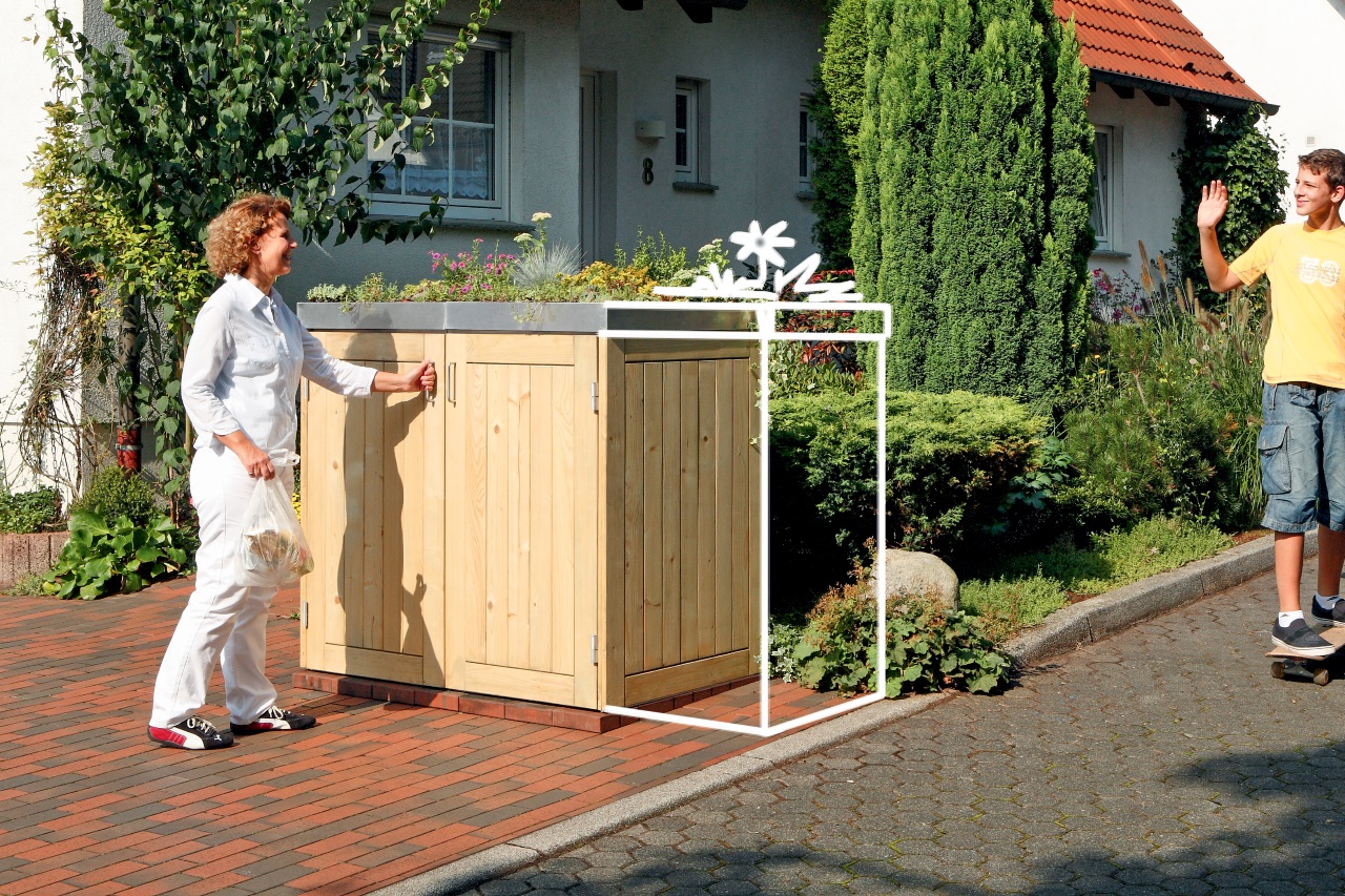Mülltonnenbox aus hellem Holz mit Pflanzdach – ideal für den Alltagseinsatz direkt am Gehweg oder in der Einfahrt
